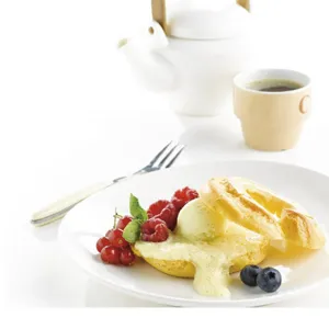 Western cutlery detail shot featuring a clean dessert plate and elegant tableware setup
