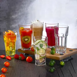 Detailed view of assorted colorful drinks in transparent octagonal acrylic cups on a tray