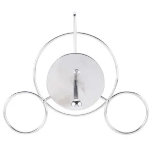 Macro detail of polished silver metal onion ring and donut display stand tower