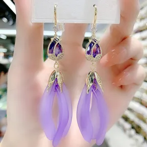 Elegant long drop earrings featuring purple resin petals and micro-pave cubic zirconia