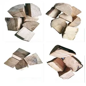 Natural oak and hickory wood chunks showing authentic split texture for BBQ smoking