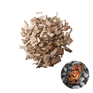Macro view of premium natural wood smoking chips for BBQ with stainless smoker box insert