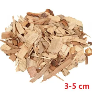 Macro detail view of 3-5 cm natural oak and hickory wood chips for BBQ smoking and grilling