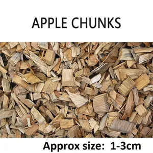 High-quality close-up detail of apple wood smoking chunks showing 1-3cm natural texture