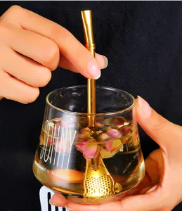 Detailed view of gold 304 stainless steel filter straw spoon used in rosebud tea