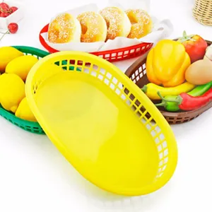 Durable oval plastic baskets in multiple colors for serving fast food and fruit