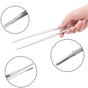 Detailed views of long stainless steel kitchen tweezers for BBQ and food serving