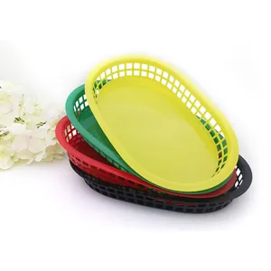 Detailed macro view of four stacked colorful plastic fast food baskets with lattice design