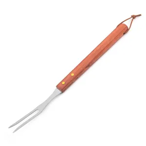 Stainless steel meat fork detail with a durable wooden handle and handy leather loop.