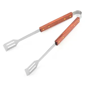 Detail view of durable stainless steel BBQ tongs with high-quality wooden handles