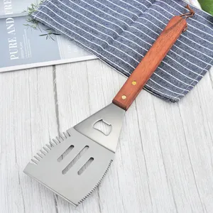 Detail of multifunctional BBQ spatula with integrated bottle opener and wooden handle
