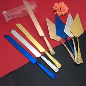 Close-up of colorful stainless steel cake knife and server set with vintage patterns