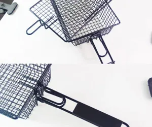 Detail shot of black non-stick BBQ grill basket with foldable handle mechanism