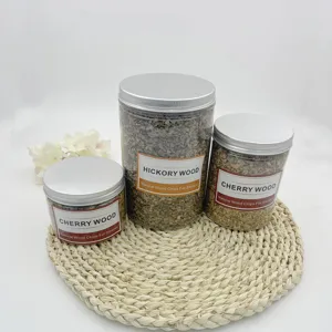 Close-up of natural cherry and hickory wood chips in clear storage jars for cocktail smokers