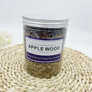 Close-up detail of natural apple wood chips in a clear jar for cocktail smoker gun