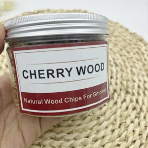 Natural cherry wood chips in a transparent jar for cocktail smokers and BBQ.