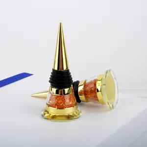 Detailed view of the creative golden cone-top wine stopper with orange crystal filler