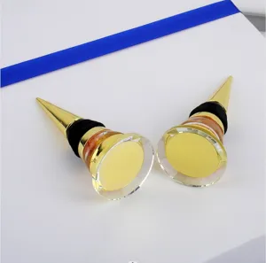 Detailed close-up showing two elegant gold zinc alloy wine stoppers with crystal-like tops
