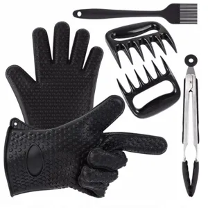 Detail view of BBQ tool set including heat resistant silicone gloves, meat claws and brush.