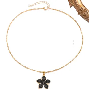 Elegant gold-tone necklace with black enamel flower pendant for women