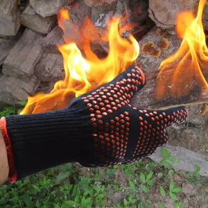 Heat resistant BBQ gloves black knit fire retardant oven mitts for cooking and baking.
