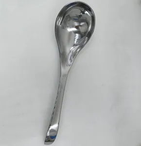 Macro view of a polished stainless steel soup spoon with a sturdy long handle.