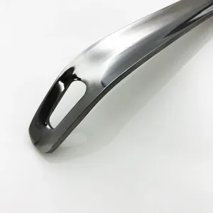 Close-up detail of thickened stainless steel soup spoon handle with hanging hole.