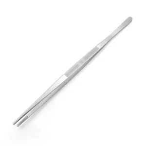 Detailed macro view of long stainless steel kitchen tongs featuring an anti-slip grip