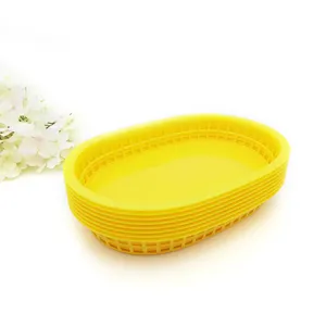 Detail view of vibrant yellow stackable plastic food baskets for restaurant and picnic use