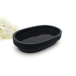 Stackable black plastic oval mesh baskets for serving fast food, fried chicken and fruit