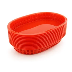 Close-up view of stacked red plastic food baskets designed for hot dogs and french fries