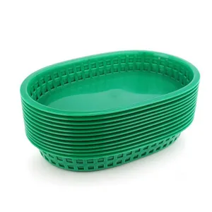 Stack of green plastic oval food baskets for restaurant serving and picnic snacks