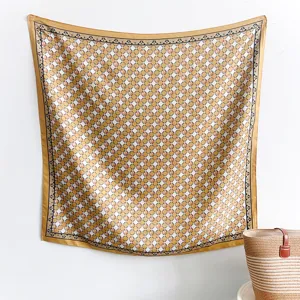 Detail view of a 90cm square silk scarf featuring a classic yellow and white lattice pattern