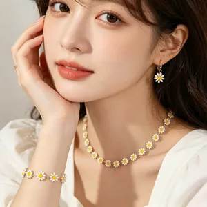 Close-up view of a model wearing a Bohemian oil-drop daisy necklace, bracelet, and earrings