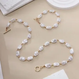 Detail view of vintage baroque pearl jewelry set with unique irregular pearls and OT buckle