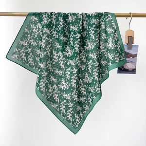 Detailed view of a green vintage floral 100% cotton bandana and neck scarf accessory