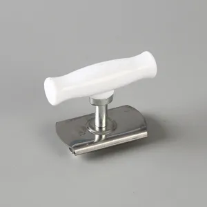 Detail view of the ergonomic white handle and durable stainless steel can opener mechanism