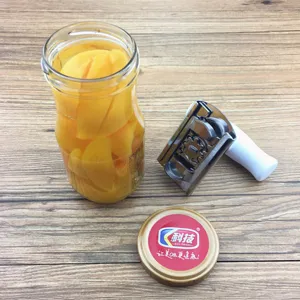 Macro view of the functional adjustable stainless steel jar opener on wooden surface.