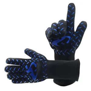 Detail shot of black heat-resistant BBQ gloves with blue silicone grips for grilling and baking.