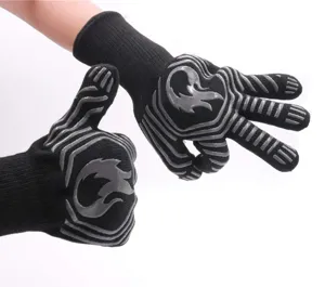 Detailed view of black heat resistant BBQ gloves featuring non-slip silicone patterns.