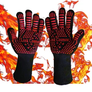 Heat-resistant BBQ gloves with red silicone grip dots and extended sleeves for safe cooking.