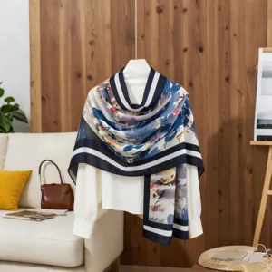 Artistic floral cotton linen scarf draped over a white blouse in a cozy home setting
