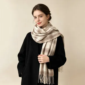 Elegant beige and brown plaid scarf with tassels for winter, model wearing black coat