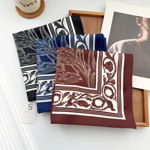 Elegant floral printed square scarves in black, blue, and burgundy for women.