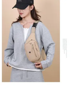 Model wearing a lightweight beige nylon chest bag for casual outdoor activities