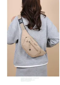 Back view of a lightweight beige casual chest bag worn over a grey sweatshirt for women
