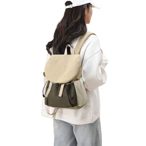 Casual large capacity travel backpack for women, lightweight two-tone design for commuting.