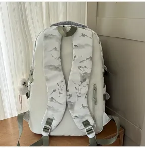 Back view of a white student backpack with ink wash landscape pattern on straps