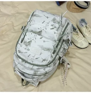 Detailed view of fashionable white backpack with nature-inspired ink print and cords