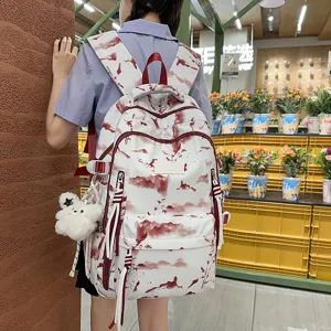 Lifestyle back view of a white student backpack with a red mountain landscape pattern